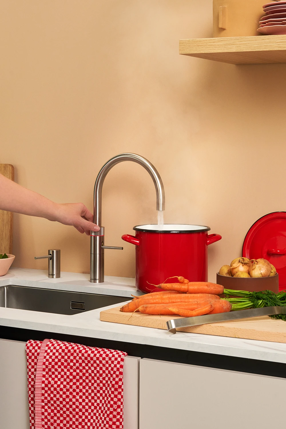 Quooker Fusion Round Stainless Steel tap filling a pan