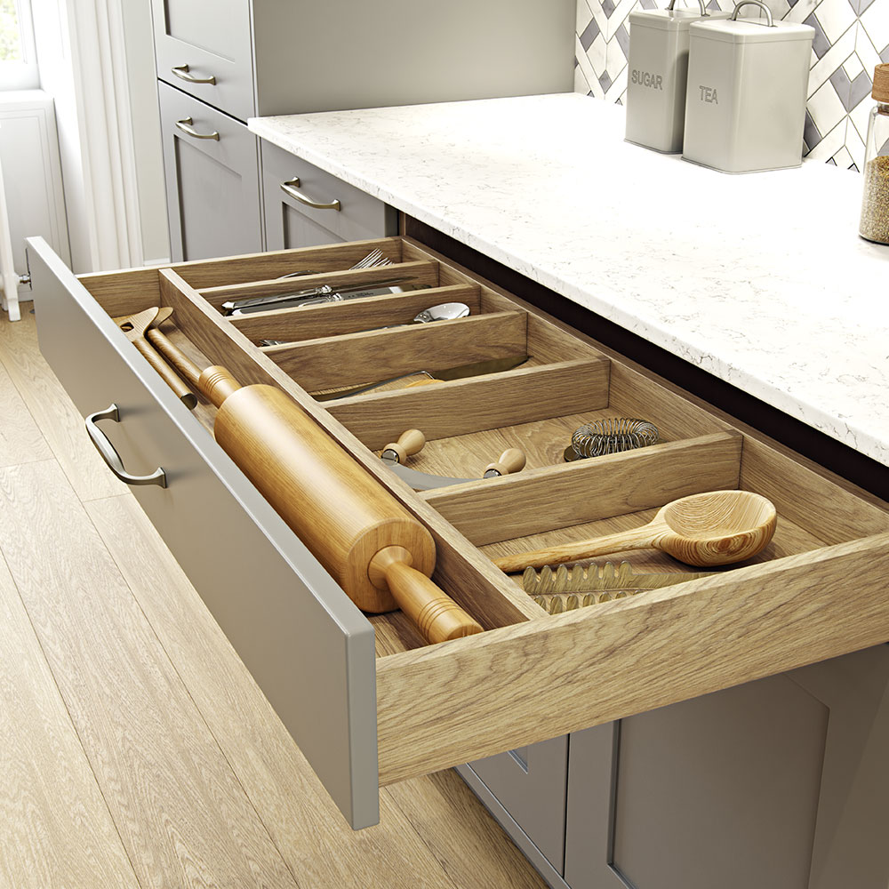 Häcker kitchen with soft taupe gloss cabinetry and graphite island, finished with quartz worktops and Neff appliances